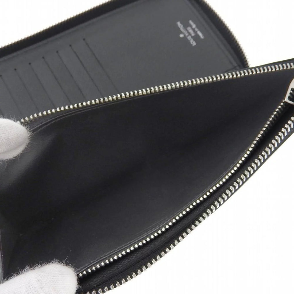 Pre-Owned Louis Vuitton LOUIS VUITTON Taiga Zippy Wallet Vertical Round Zipper Long Noir M30503 (Good)