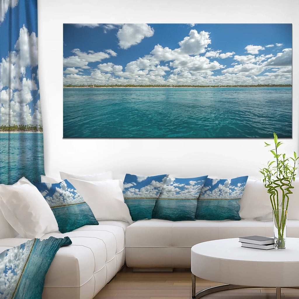 DESIGN ART Designart "White Fluffy Clouds Over Sea" Oversized Beach Canvas Artwork 20 in. wide x 12 in. high
