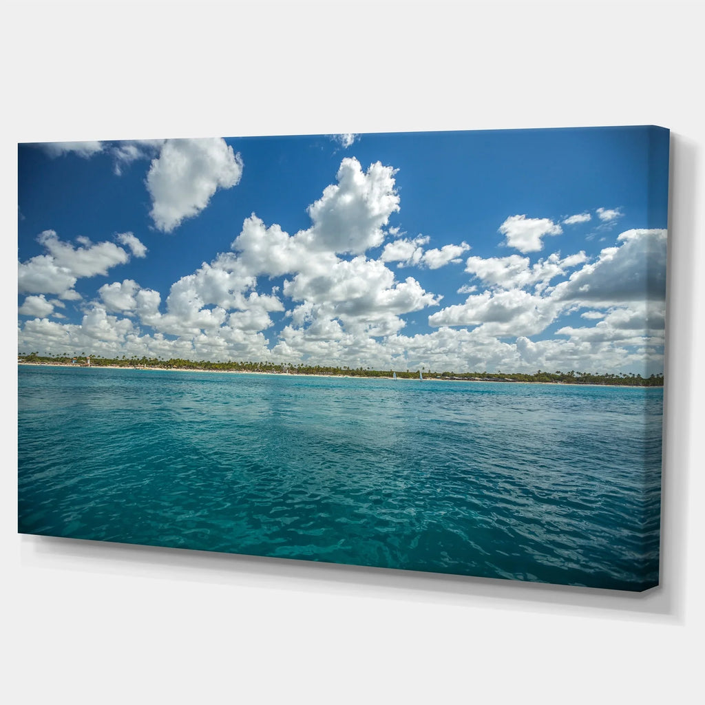 DESIGN ART Designart "White Fluffy Clouds Over Sea" Oversized Beach Canvas Artwork 20 in. wide x 12 in. high