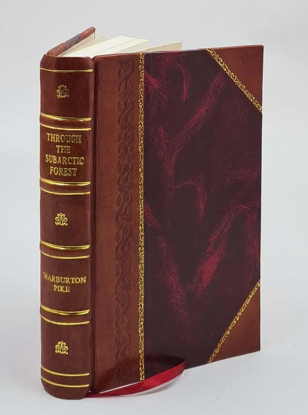 Through the subarctic forest A record of a canoe journey from Fort Wrangel to the Pelley lakes and down to the Yukon River to the Behring Sea 1896 [Leather Bound]